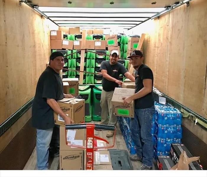 SERVPRO employees delivering supplies 