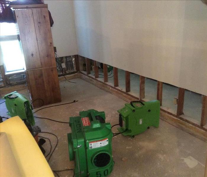 SERVPRO equipment of the floor of a room that is missing drywall